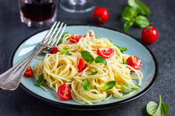 Spaghetty pasta  with cherry tomatoes,  basil and parmesan chees
