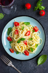 Spaghetty pasta  with cherry tomatoes,  basil and parmesan chees