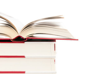 Open book on a stack of books