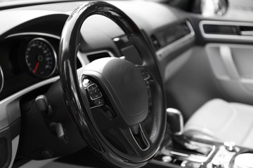 Modern car illuminated dashboard and steering wheel