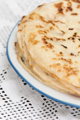 Fresh baked pancakes served on a plate