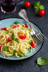 Spaghetty pasta  with cherry tomatoes,  basil and parmesan chees
