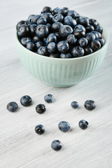 Fresh blueberries in bowl on table close up