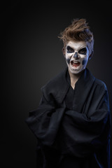 teenager with makeup skull cape