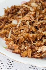 Chinese food noodles with chicken meat and cabbage