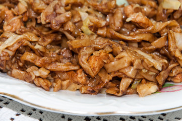 Chinese food noodles with chicken meat and cabbage