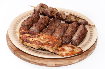 Mixed grilled meat served on the plate