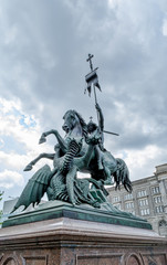 The statue of St. George fighting the dragon in Berlin. It is located on the small square on the waterfront of the Spree.
