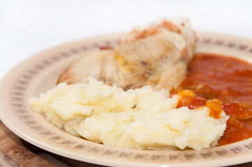 Meat with tomato stew and mashed potato