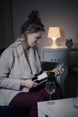 Woman opening bottle of wine