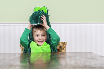 Beautiful child in crocodile costume