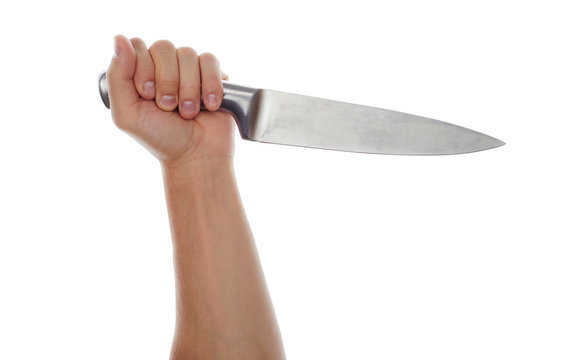 Male hand holding big silver kitchen knife