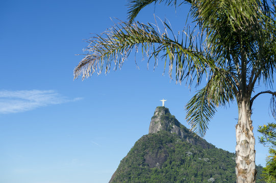 Corcovado mountain Christ the Redeemer standing at the top of green jungle in Tijuca National Forest in Rio de Janeiro Brazil