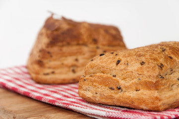 Puff pastry on the kitchen tablecloth and wooden board