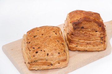 Fresh bakery puff pastry on the wooden board