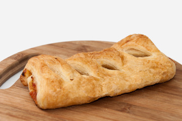 Stuffed pizza puff pastry on the wooden board