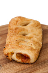 Stuffed pizza puff pastry on the wooden board