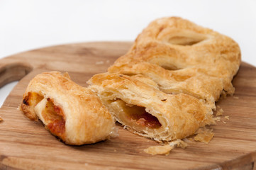 Sliced pizza puff pastry on the wooden board