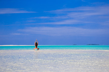 Fototapeta na wymiar Young happy woman enjoy tropical vacation on white sandy beach