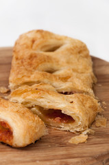 Sliced pizza puff pastry on the wooden board