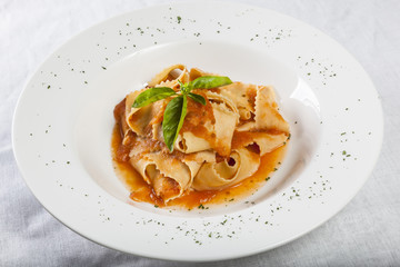 Pappardelle with tomato sauce and basil