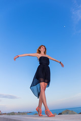 Fototapeta premium Young beautiful woman jumping