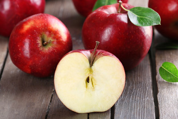 Ripe red apples on table close up