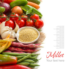 Raw millet in bowl and vegetables