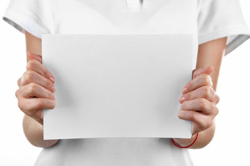 Woman holding paper blank close up