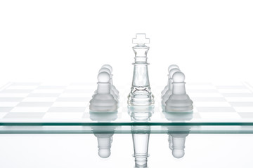 Surrounded king chess, business strategy, transparent glass Ches