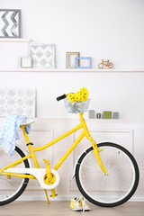 Fototapeta na wymiar Yellow retro bicycle in spacious bright room