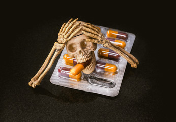 skeleton human with capsule hard drug concept