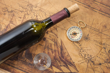 bottle of wine  on the background of old maps