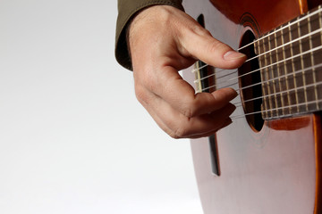 in the chord playing classical guitar closeup