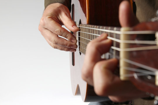in the chord playing classical guitar closeup
