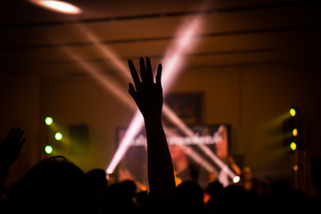 christian music concert with raised hand