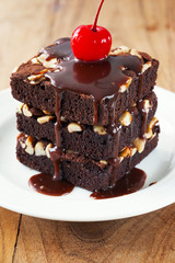 chocolate brownie with chocolate souce and cherry
