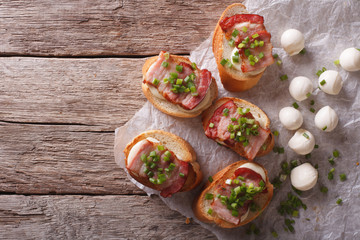 crostini with bacon and mozzarella cheese. horizontal top view
