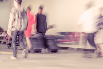 Blur motion of passengers walking at airport
