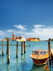 Boat parked beside the Riva degli Schiavoni in Venice, Italy