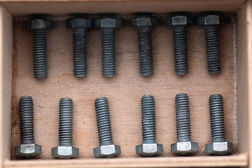 Fototapeta premium screws and bolts in a box