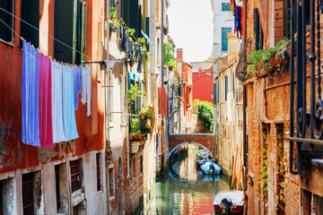 Fototapeta na wymiar Laundry drying on clothesline above canal of Venice