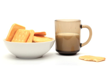  Crackers with a glass of milk on a white background