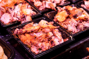 Pulpo a la gallega, typical spanish dish at the boqueria market in Barcelona