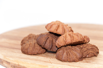 Brown chocolate cookies on the wooden board