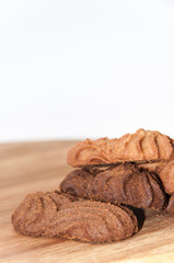 Brown chocolate cookies on the wooden board