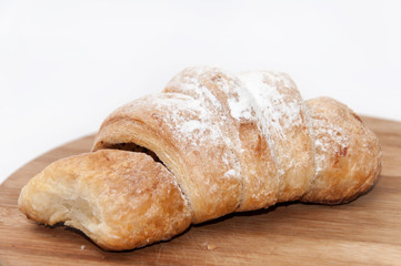 Puff pastry with fruit jam on the wooden board