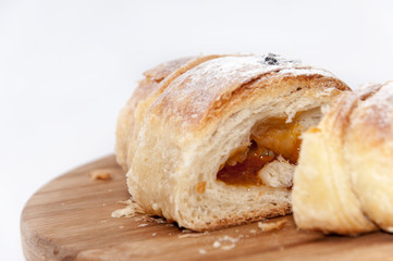 Puff pastry sliced on the wooden board