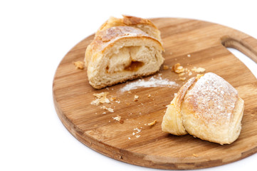Piece of puff pastry on the wooden board