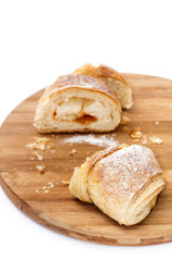 Piece of puff pastry on the wooden board
